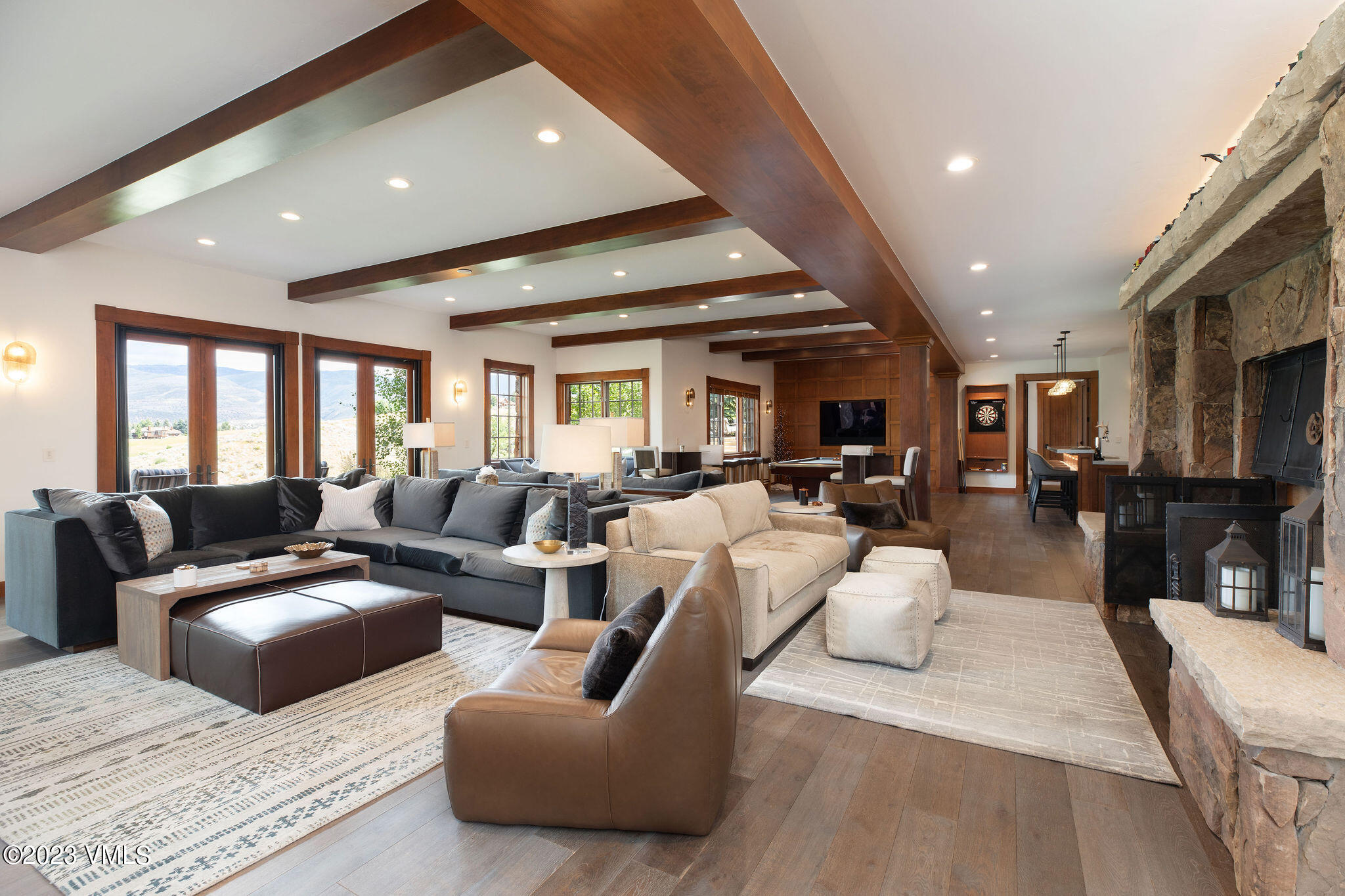 520 Old Creamery Road Edwards, CO 81632 - Photo 33 of 78 a living room with furniture kitchen view and a chandelier