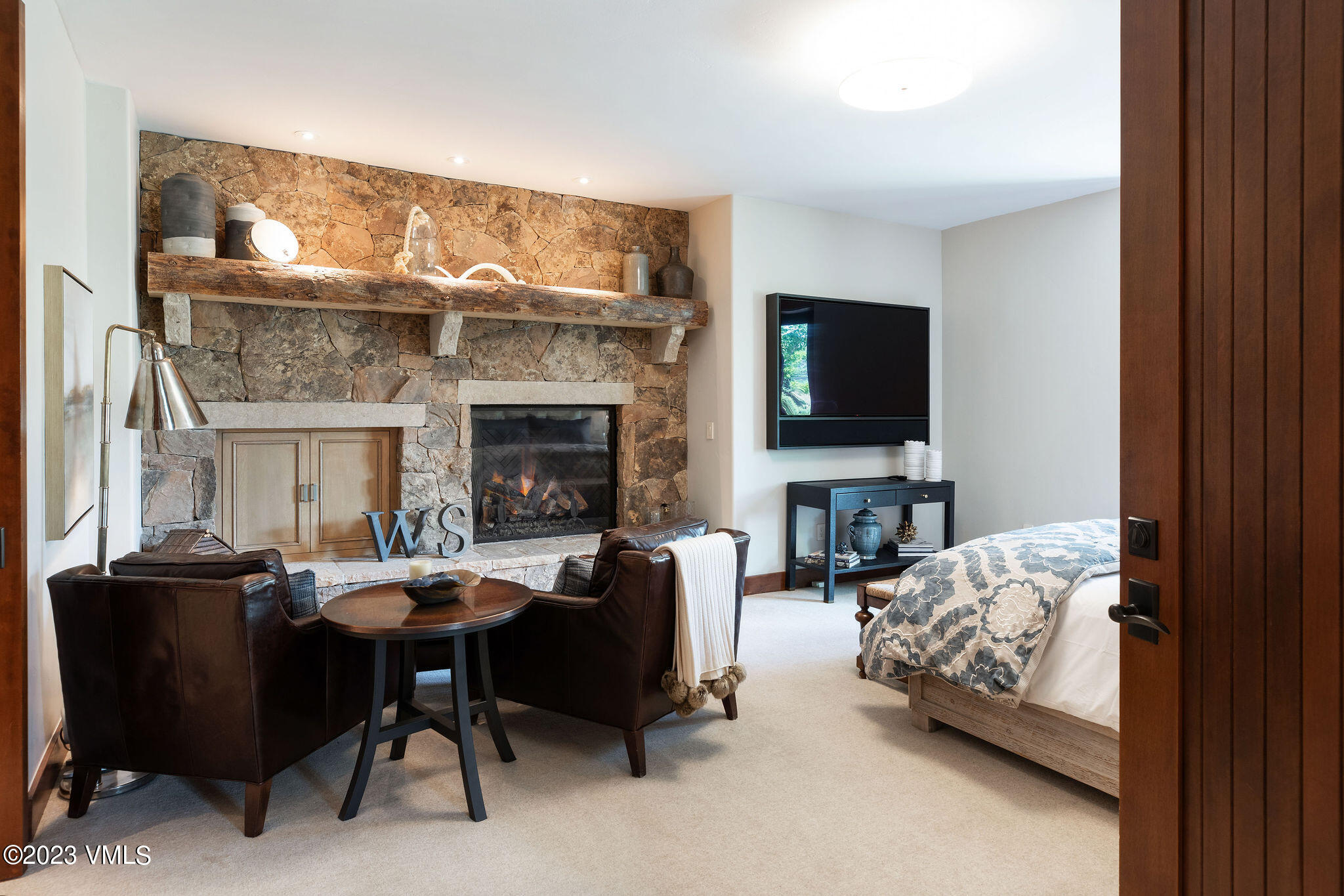 520 Old Creamery Road Edwards, CO 81632 - Photo 34 of 78 a living room with furniture a fireplace and a flat screen tv