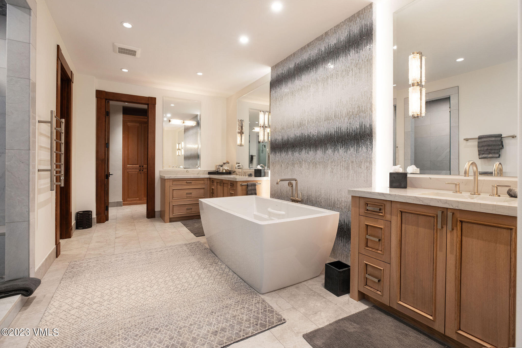 520 Old Creamery Road Edwards, CO 81632 - Photo 36 of 78 a bathroom with a bathtub a sink a mirror and a shower
