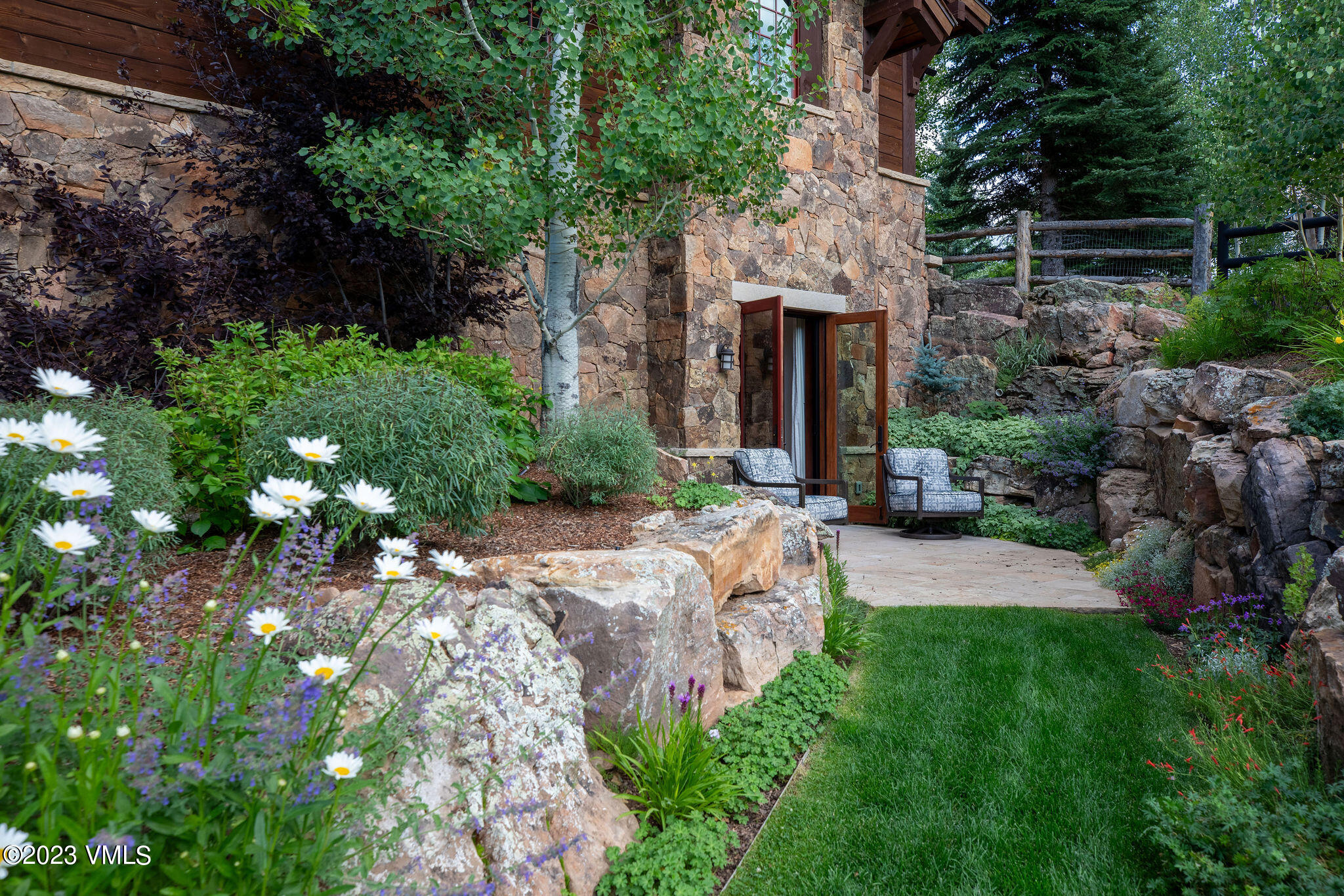 520 Old Creamery Road Edwards, CO 81632 - Photo 39 of 78 a view of an entrance to house with yard and green space