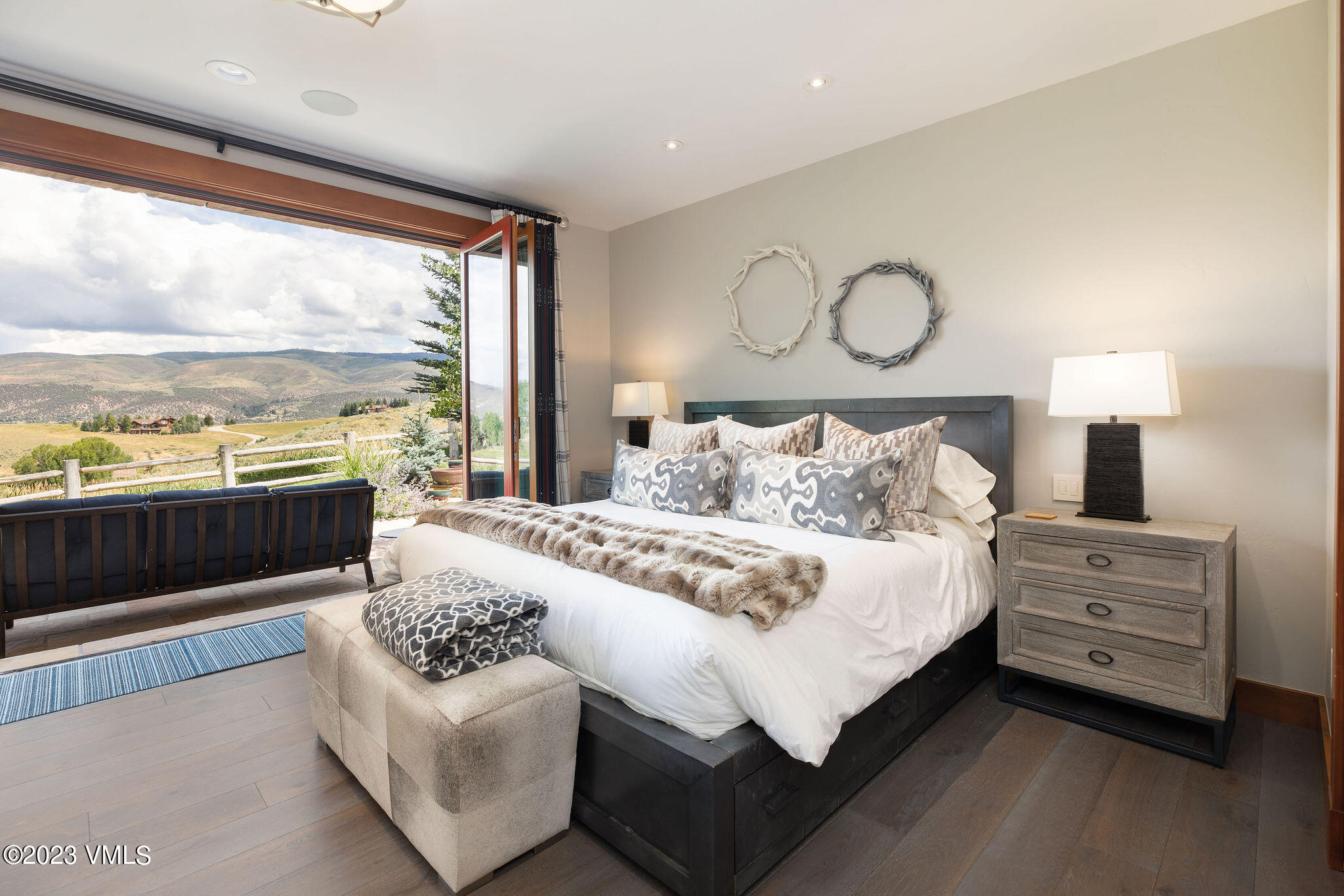 520 Old Creamery Road Edwards, CO 81632 - Photo 44 of 78 a bedroom with a bed and a night stand