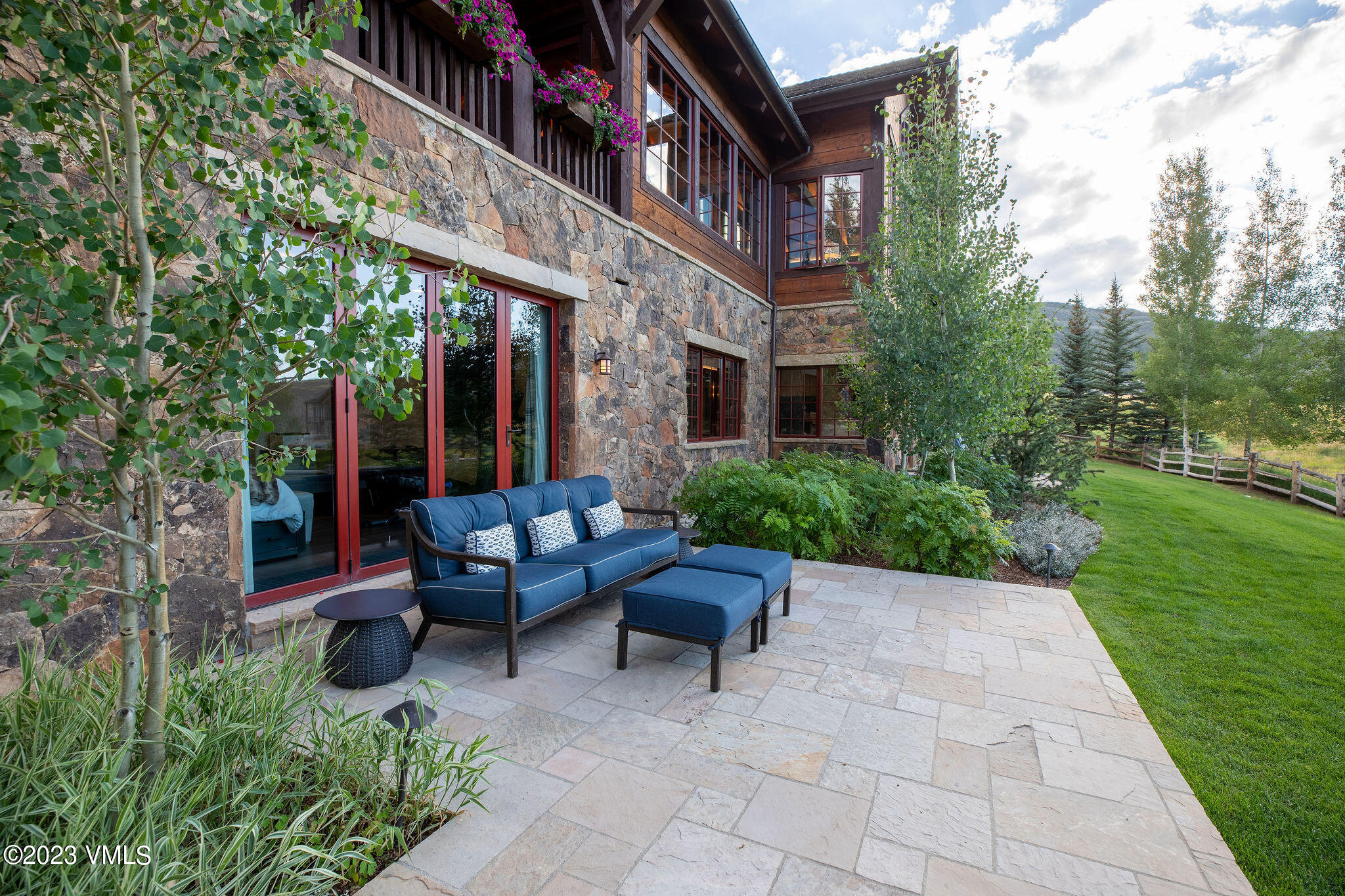 520 Old Creamery Road Edwards, CO 81632 - Photo 45 of 78 a view of a patio with couches table and chairs and garden