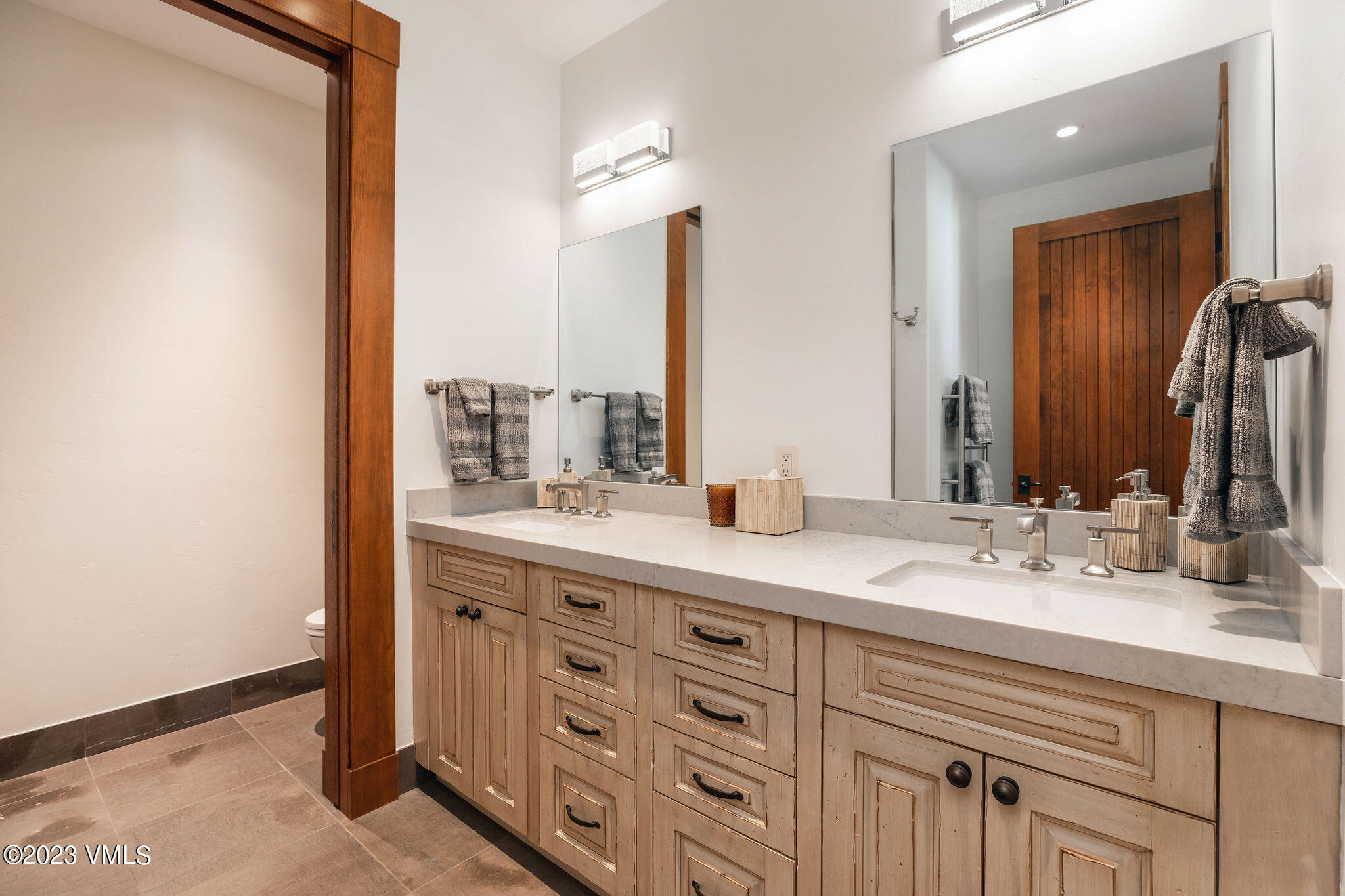 520 Old Creamery Road Edwards, CO 81632 - Photo 47 of 78 a bathroom with a double vanity sink and a mirror