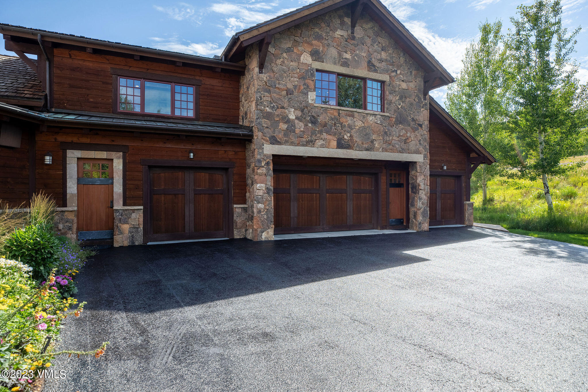 520 Old Creamery Road Edwards, CO 81632 - Photo 55 of 78 a front view of a house with a yard and garage