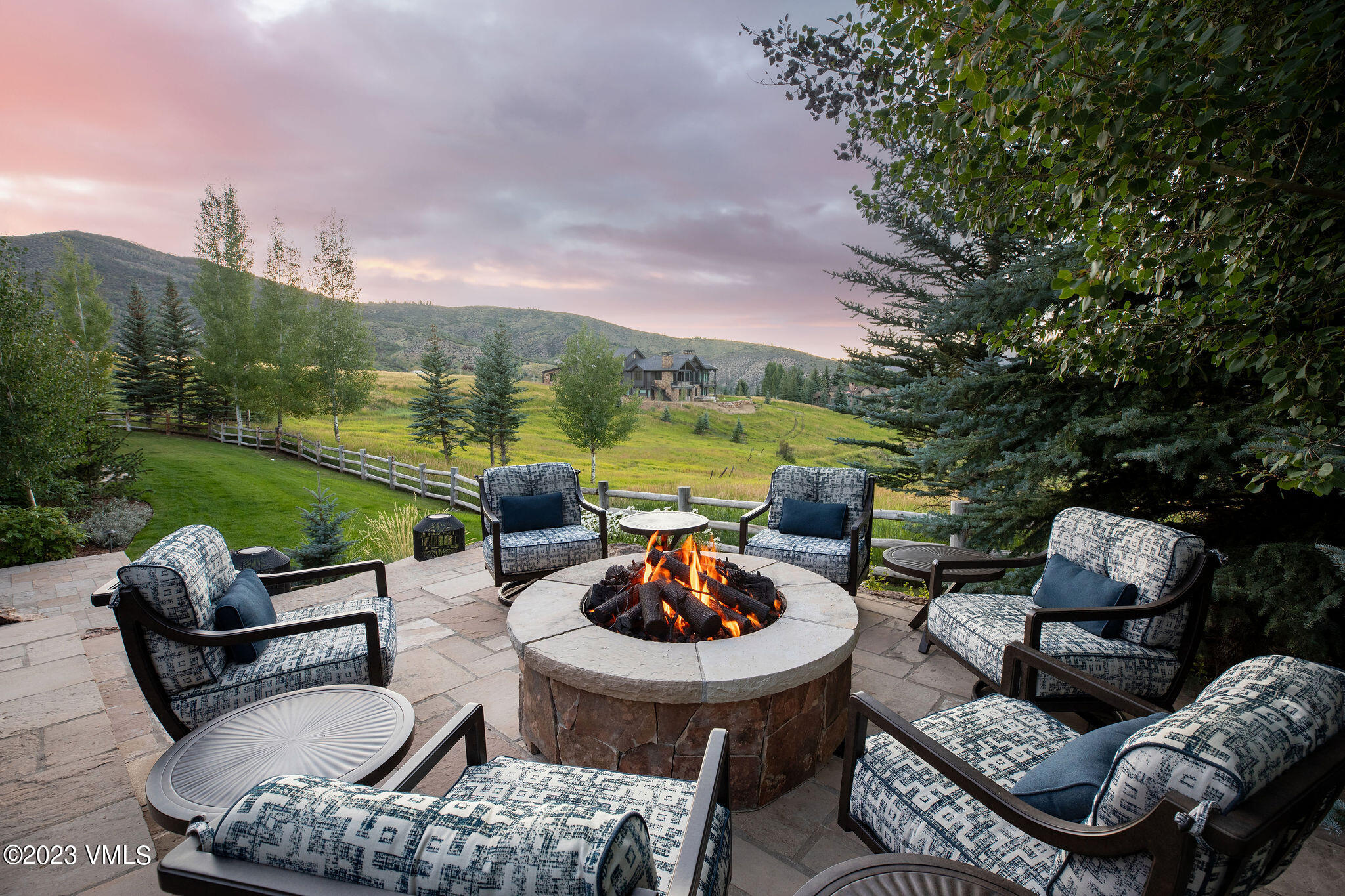 520 Old Creamery Road Edwards, CO 81632 - Photo 60 of 78 a view of a patio with lawn chairs couches and a fire pit