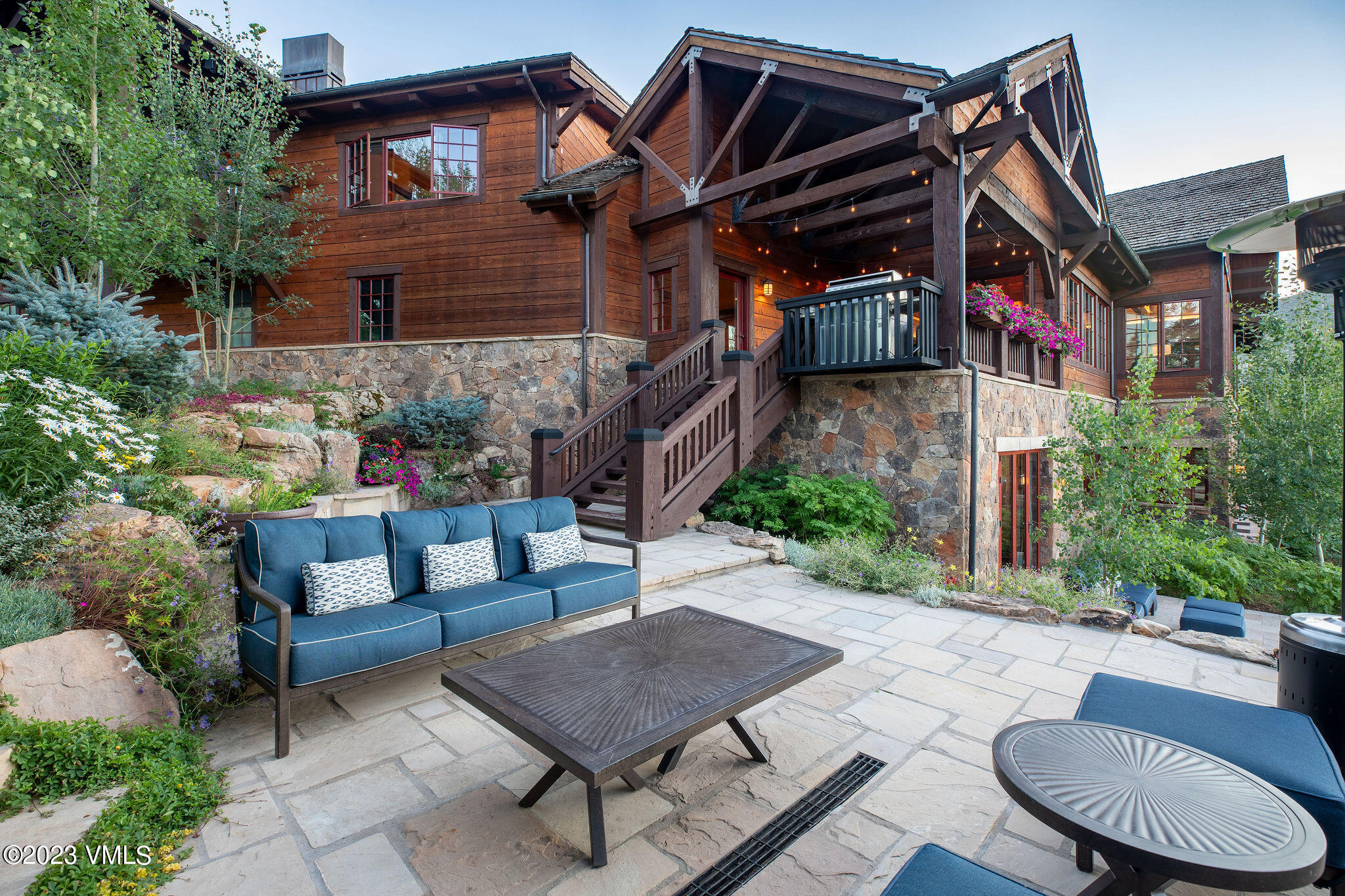 520 Old Creamery Road Edwards, CO 81632 - Photo 61 of 78 a view of a chairs and table in the patio in front of a house