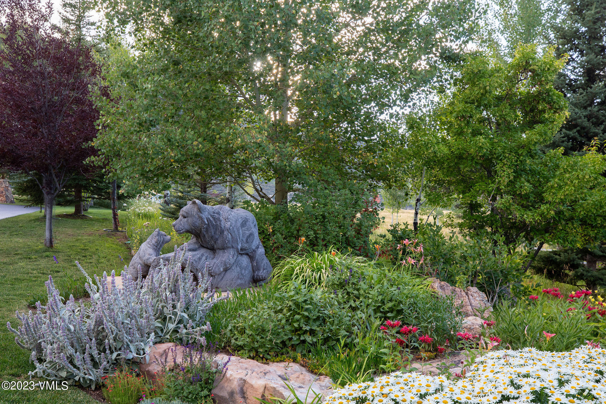 520 Old Creamery Road Edwards, CO 81632 - Photo 69 of 78 a view of a garden with plants and large trees