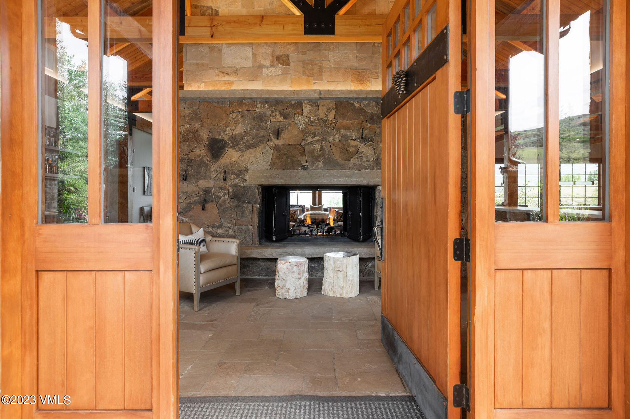 520 Old Creamery Road Edwards, CO 81632 - Photo 10 of 78 a living room with a fireplace furniture and a large window