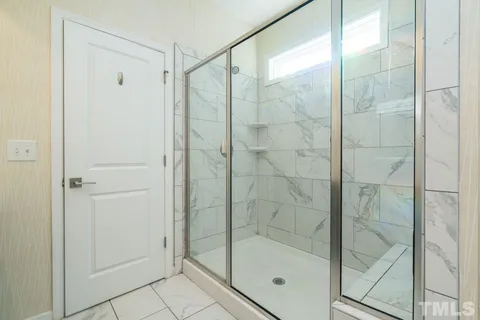 a view of a storage and utility room with washer and dryer