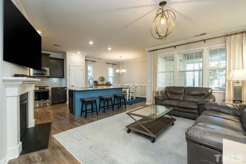 a living room with furniture fireplace and flat screen tv