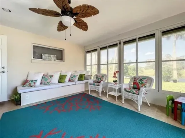a living room with furniture and a large window