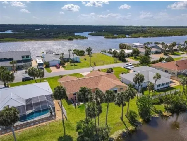 an aerial view of a houses with outdoor space