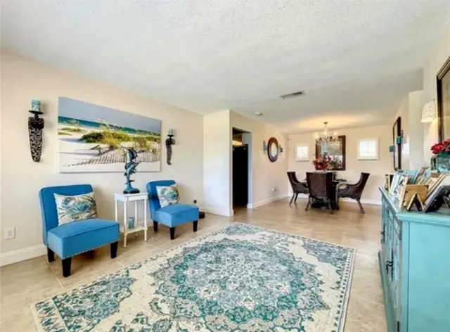 a living room with furniture and a rug