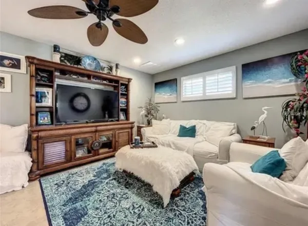 a living room with furniture and a fireplace