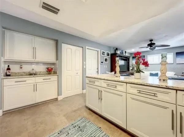 a kitchen with sink cabinets and window