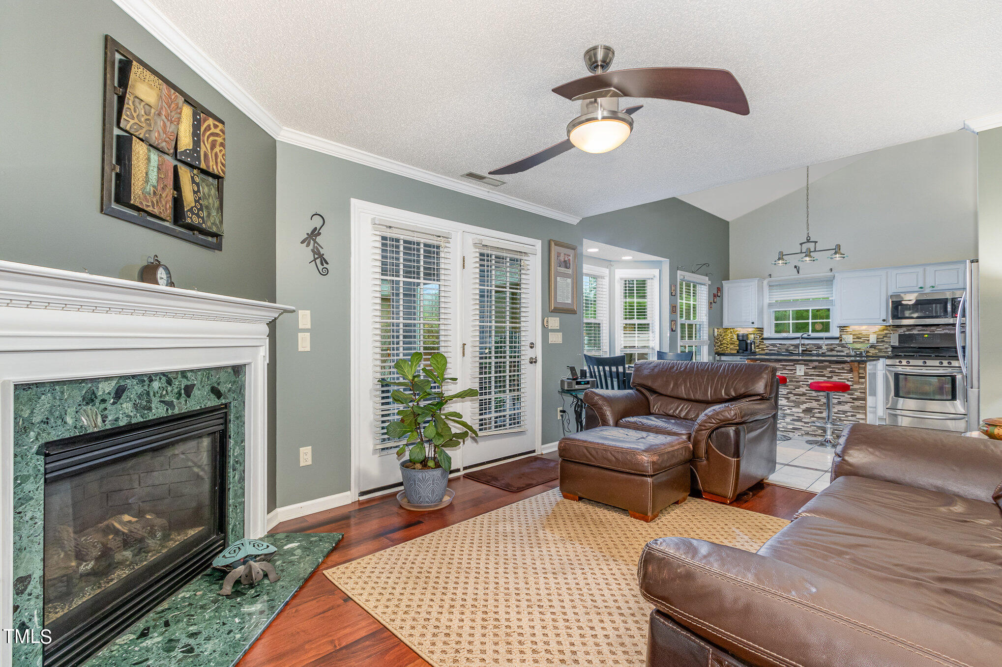 4902 Valley Ridge Drive Durham, NC 27713 - Photo 13 of 28 family room fancy fan Kitchen view