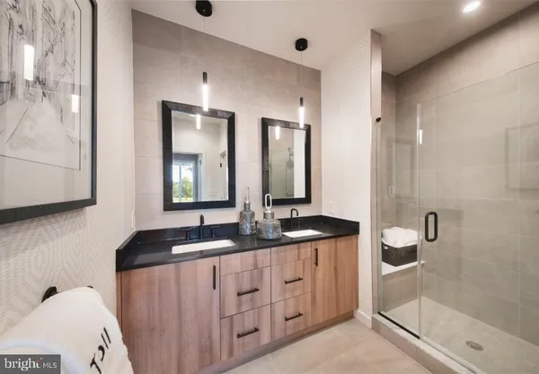 a bathroom with a double vanity sink and a mirror