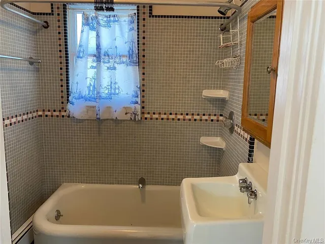 a bathroom with a sink and bathtub
