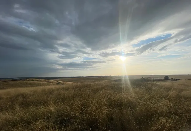 a view of an ocean and mountain