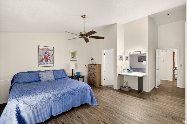 161 West 950 South, Unit Q1 St. George, UT 84770 - Photo 16 of 37 Bedroom with vaulted ceiling, wood finished floors, and ceiling fan
