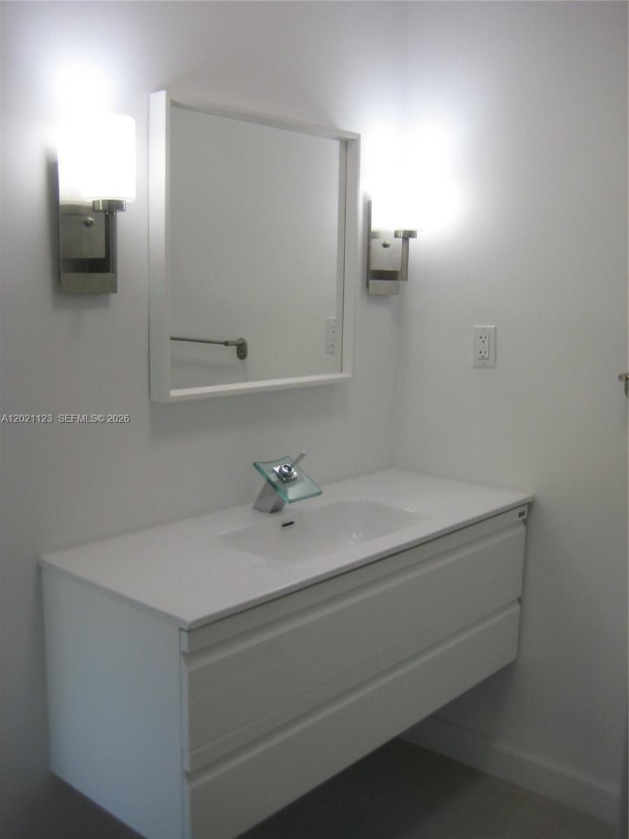 13220 Southwest 99th Place Miami, FL 33176 - Photo 8 of 16 a bathroom with a sink