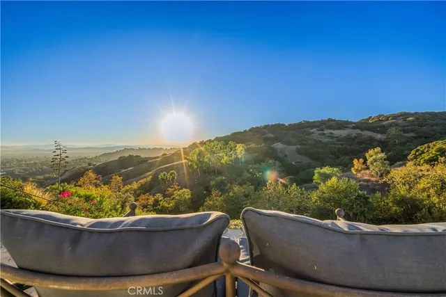 a view of a lake with couches and city view