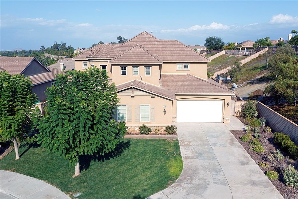 16184 Devor Circle Riverside, CA 92503 - Photo 1 of 1 a front view of a house with a yard and garage