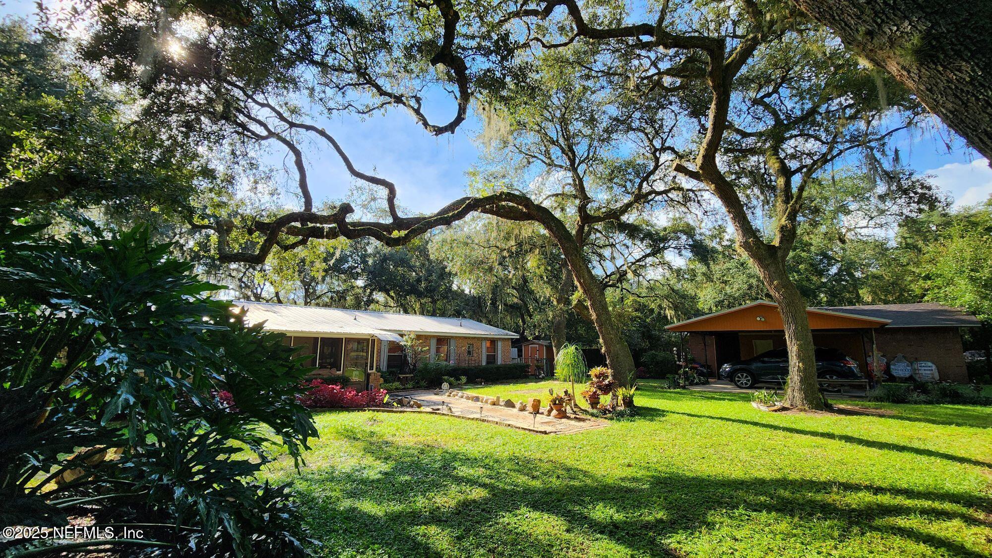7140 Pinon Road Keystone Heights, FL 32656 - Photo 2 of 50 front view to carport