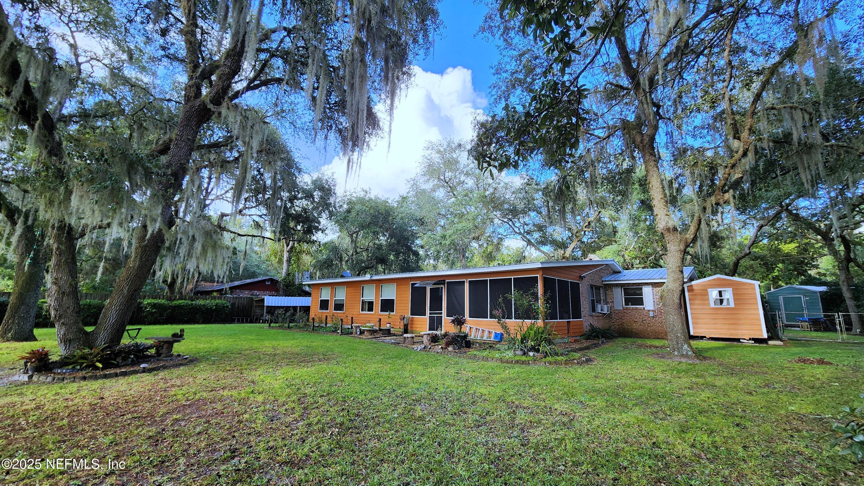 7140 Pinon Road Keystone Heights, FL 32656 - Photo 3 of 50 rear view to she &man sheds