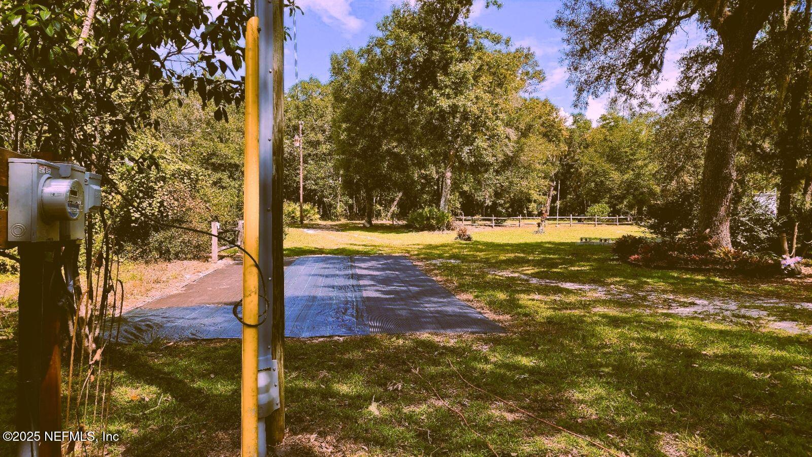 7140 Pinon Road Keystone Heights, FL 32656 - Photo 39 of 50 carport view to RV hook-ups