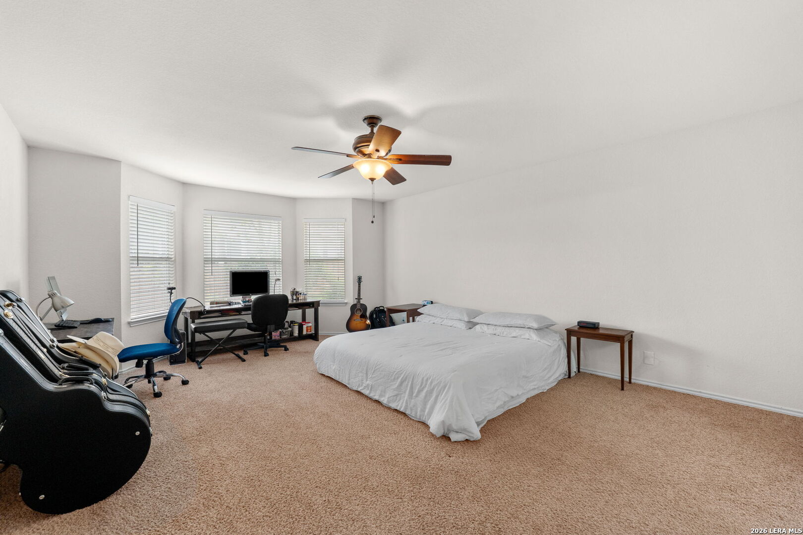 9727 Krier Court Converse, TX 78109 - Photo 11 of 31 a bedroom with bed and window
