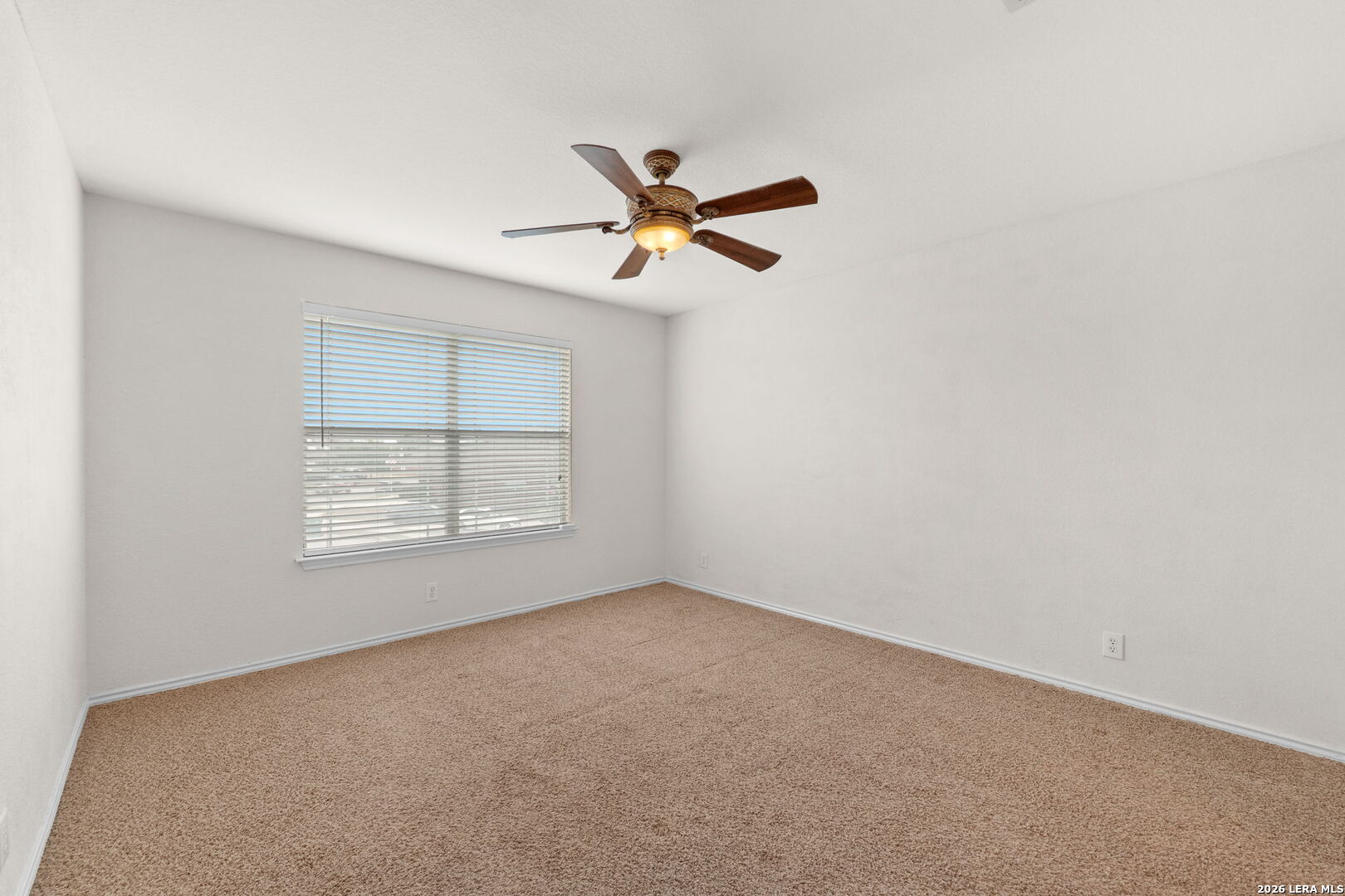 9727 Krier Court Converse, TX 78109 - Photo 18 of 31 an empty room with a window and a fan