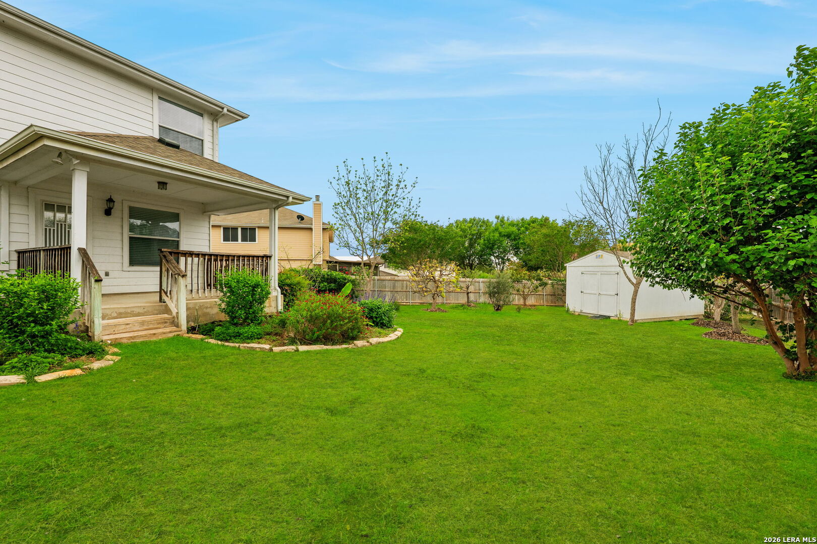 9727 Krier Court Converse, TX 78109 - Photo 26 of 31 a front view of a house with a yard and trees