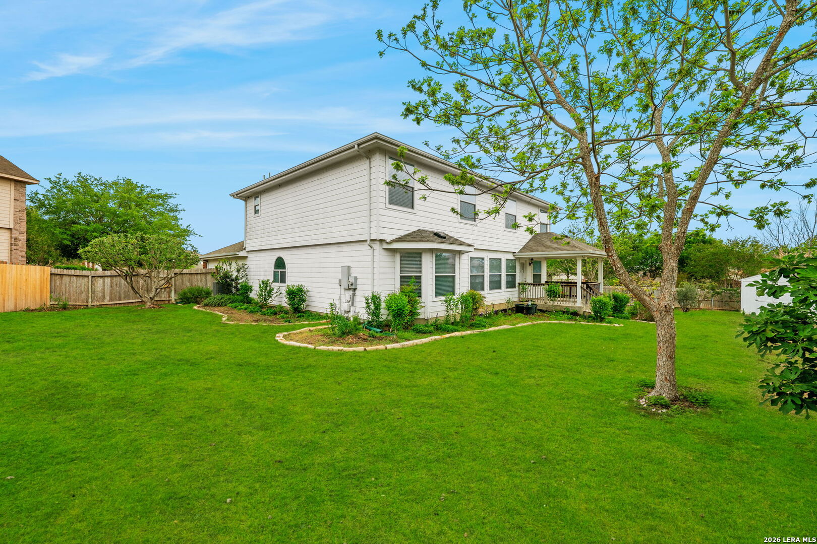 9727 Krier Court Converse, TX 78109 - Photo 27 of 31 a view of a white house with a yard and sitting area