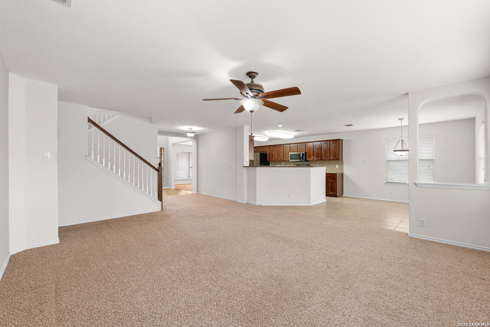 9727 Krier Court Converse, TX 78109 - Photo 3 of 31 a view of a kitchen with a sink and a refrigerator