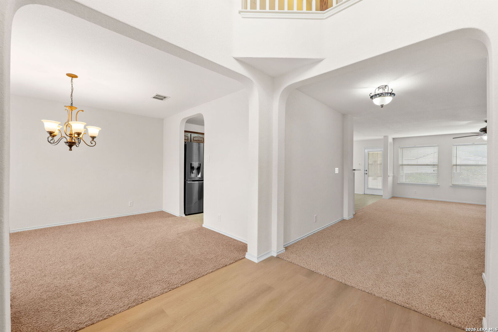 9727 Krier Court Converse, TX 78109 - Photo 5 of 31 a view of a livingroom with wooden floor and kitchen space