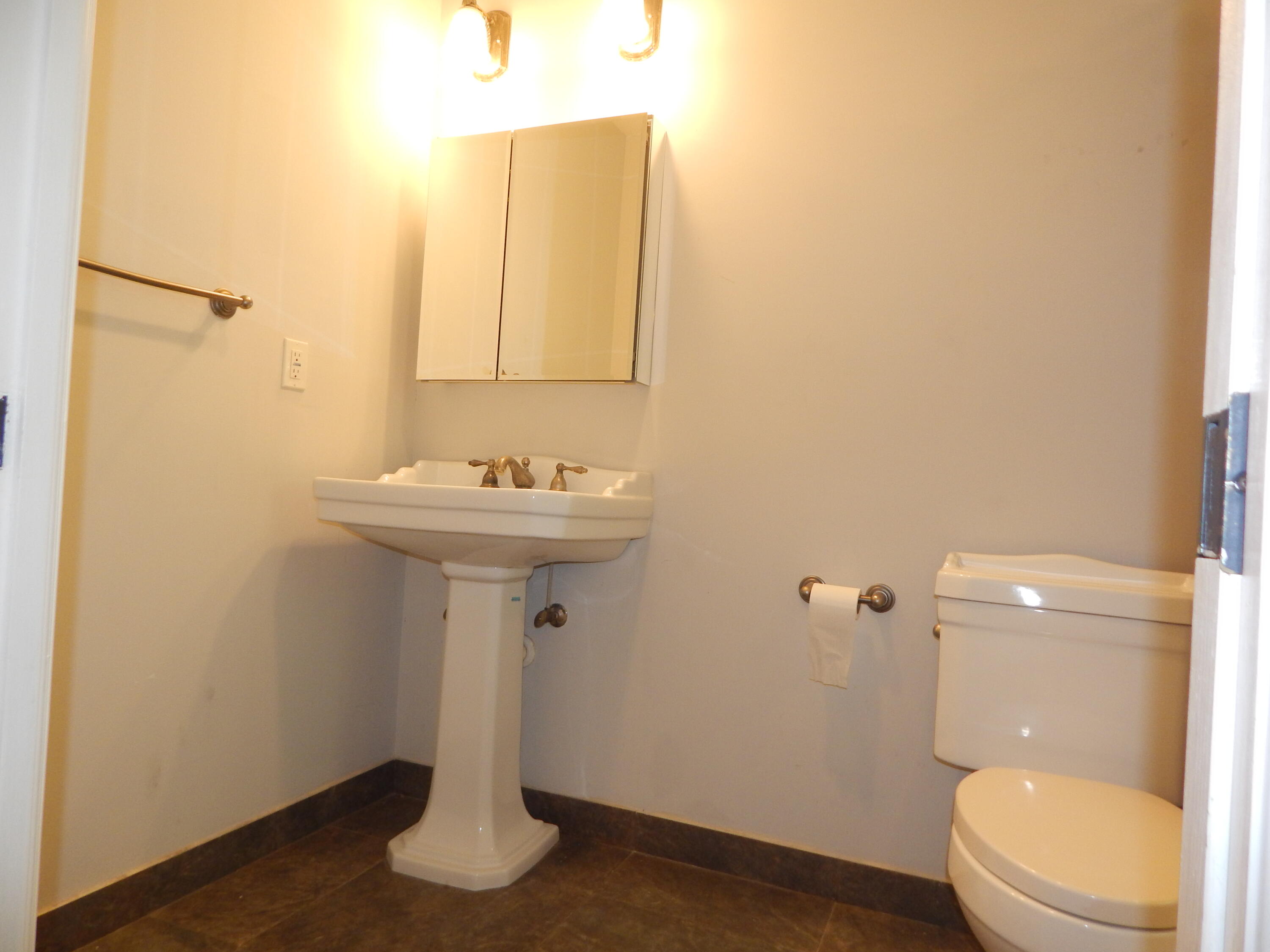 298 Northwest 11th Street Boca Raton, FL 33432 - Photo 17 of 19 a bathroom with a sink a toilet and shower