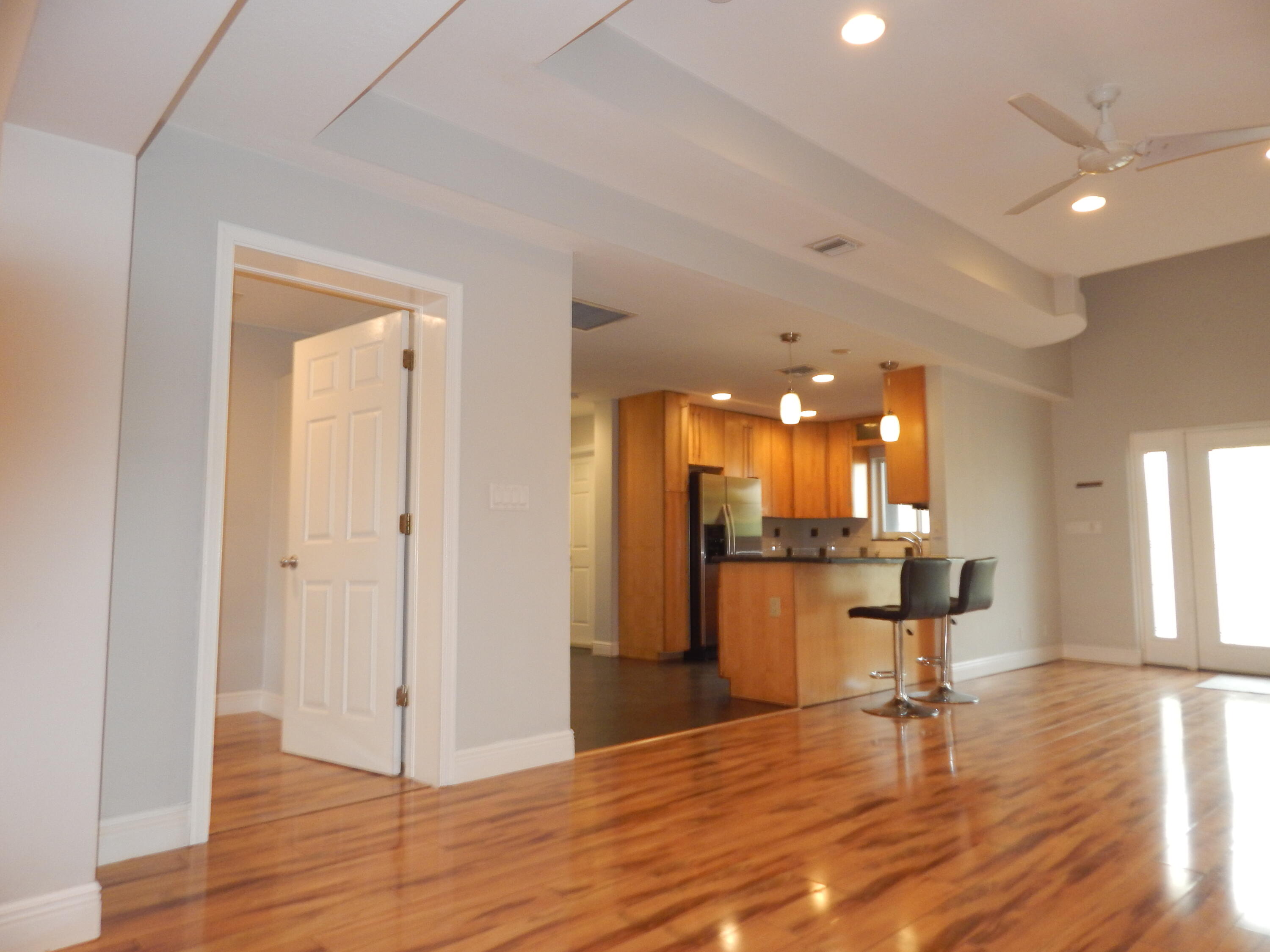 298 Northwest 11th Street Boca Raton, FL 33432 - Photo 4 of 19 a room with lots of furniture and wooden floor