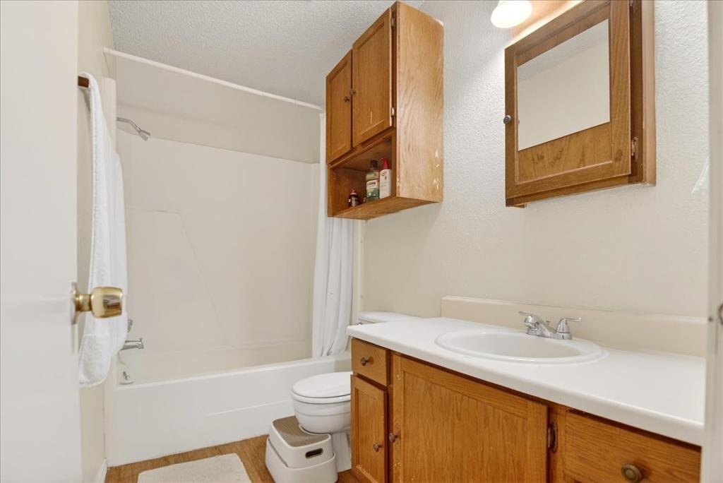 1326 South 11th Street, Unit 2 Waco, TX 76706 - Photo 7 of 11 a bathroom with a sink a toilet and shower
