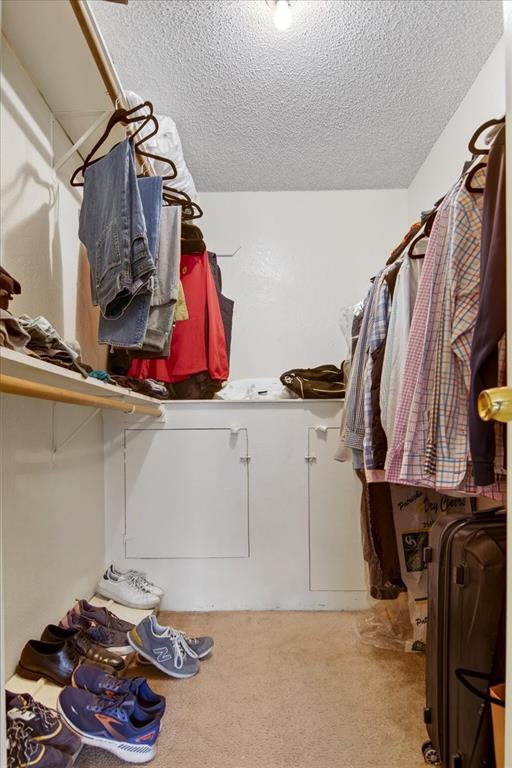 1326 South 11th Street, Unit 2 Waco, TX 76706 - Photo 8 of 11 a view of walk in closet with clothes and shoes