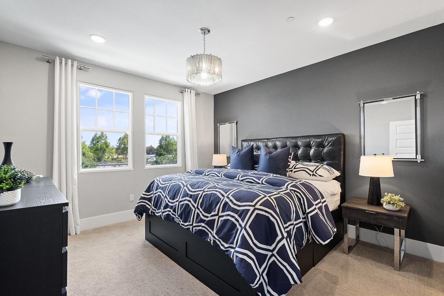 398 Circuit Way Mountain View, CA 94043 - Photo 18 of 29 a bedroom with a bed and a chandelier