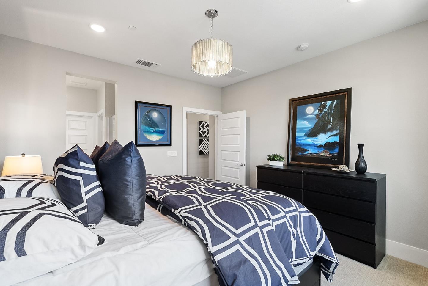 398 Circuit Way Mountain View, CA 94043 - Photo 19 of 29 a bedroom with a bed and a chandelier