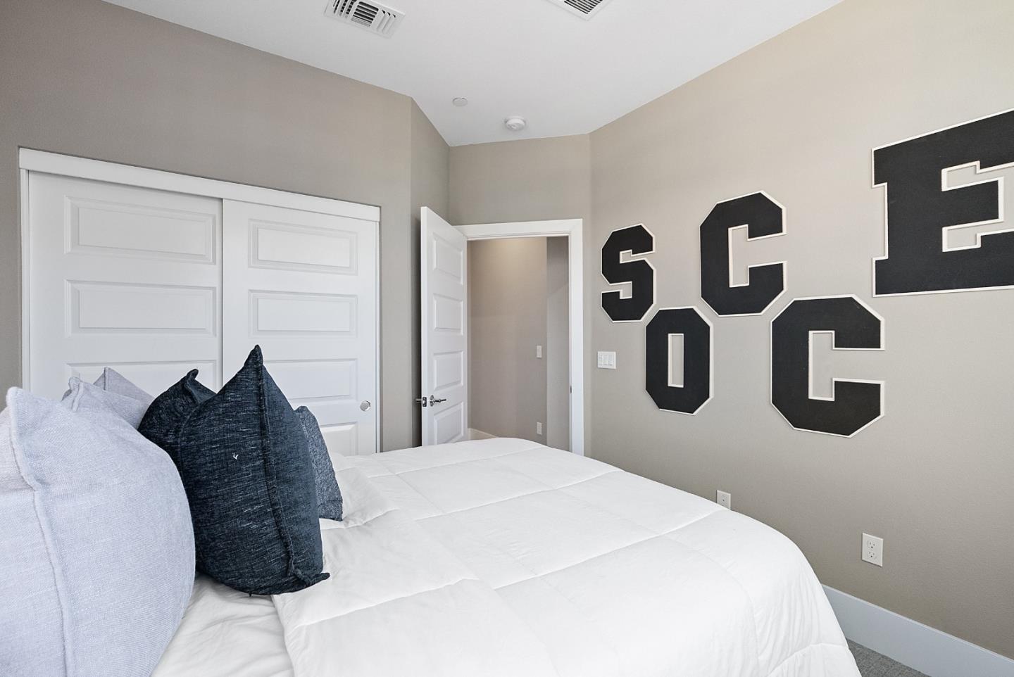 398 Circuit Way Mountain View, CA 94043 - Photo 23 of 29 a bedroom with a bed and a painting on the wall