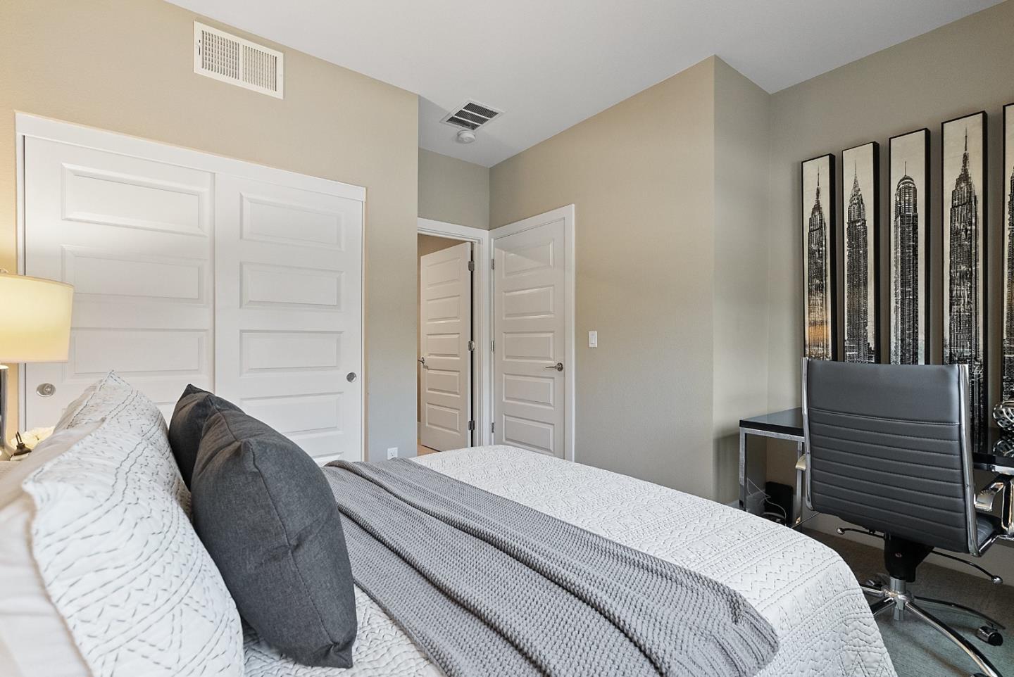 398 Circuit Way Mountain View, CA 94043 - Photo 4 of 29 a bedroom with a bed and a lamp