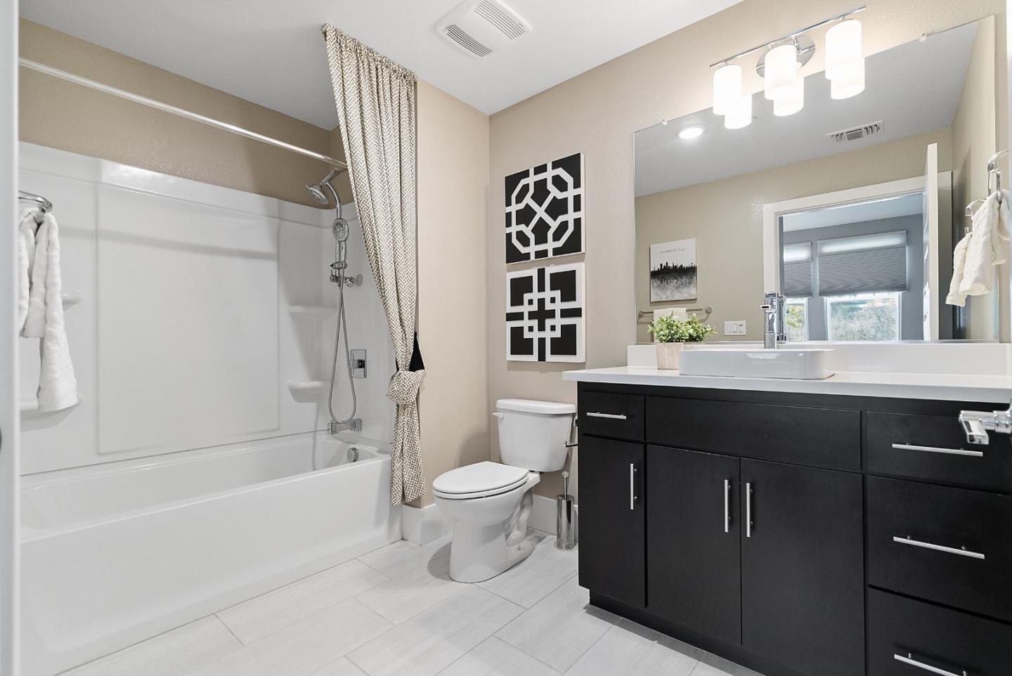 398 Circuit Way Mountain View, CA 94043 - Photo 5 of 29 a bathroom with a bathtub sink vanity mirror and toilet