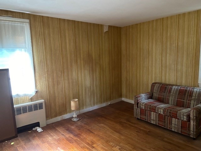 28 Martin Road Reading, MA 01867 - Photo 11 of 19 a living room with furniture and a window