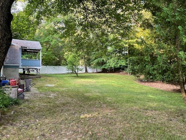 28 Martin Road Reading, MA 01867 - Photo 18 of 19 a view of a big yard with plants and large trees