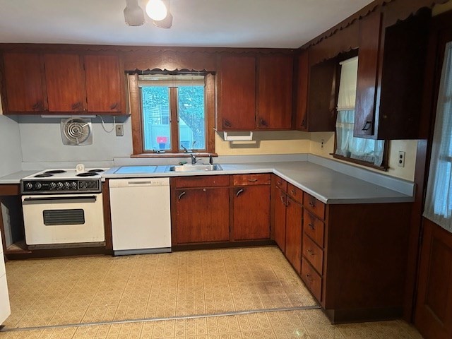 28 Martin Road Reading, MA 01867 - Photo 2 of 19 a kitchen with stainless steel appliances granite countertop a stove a sink and a microwave
