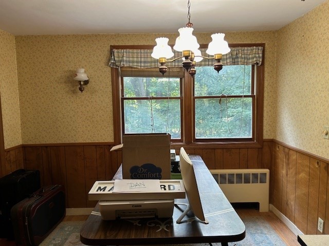 28 Martin Road Reading, MA 01867 - Photo 4 of 19 a living room with furniture and a chandelier