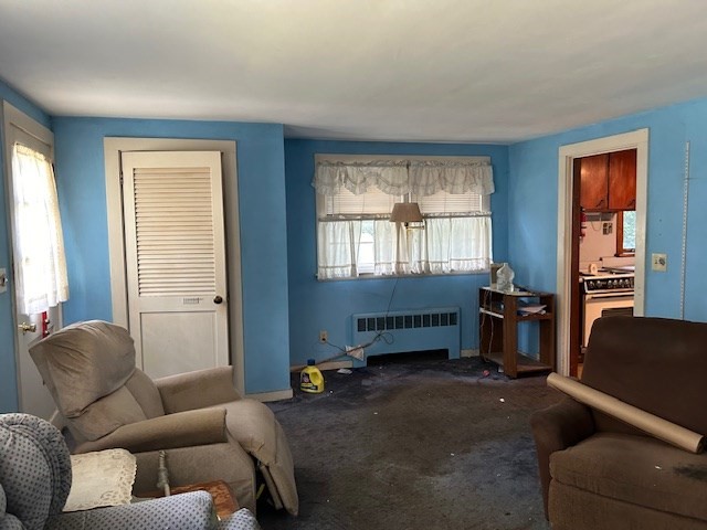 28 Martin Road Reading, MA 01867 - Photo 6 of 19 a living room with furniture and a window